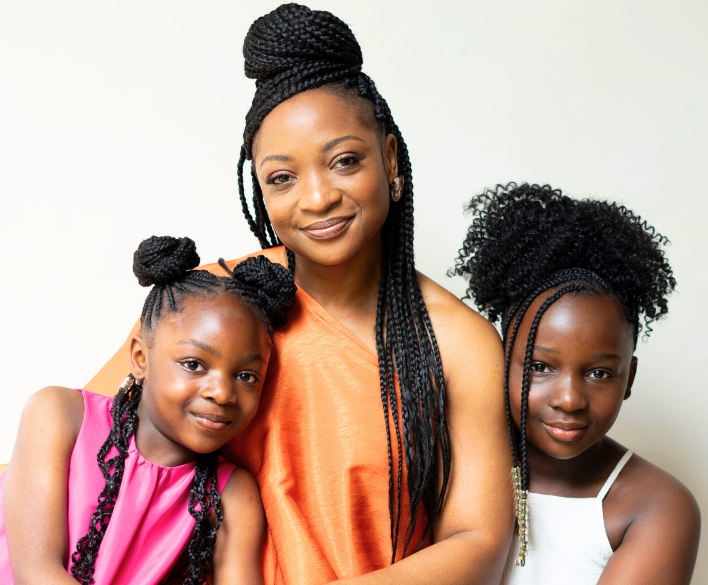 Ms Obe pictured with her two daughters