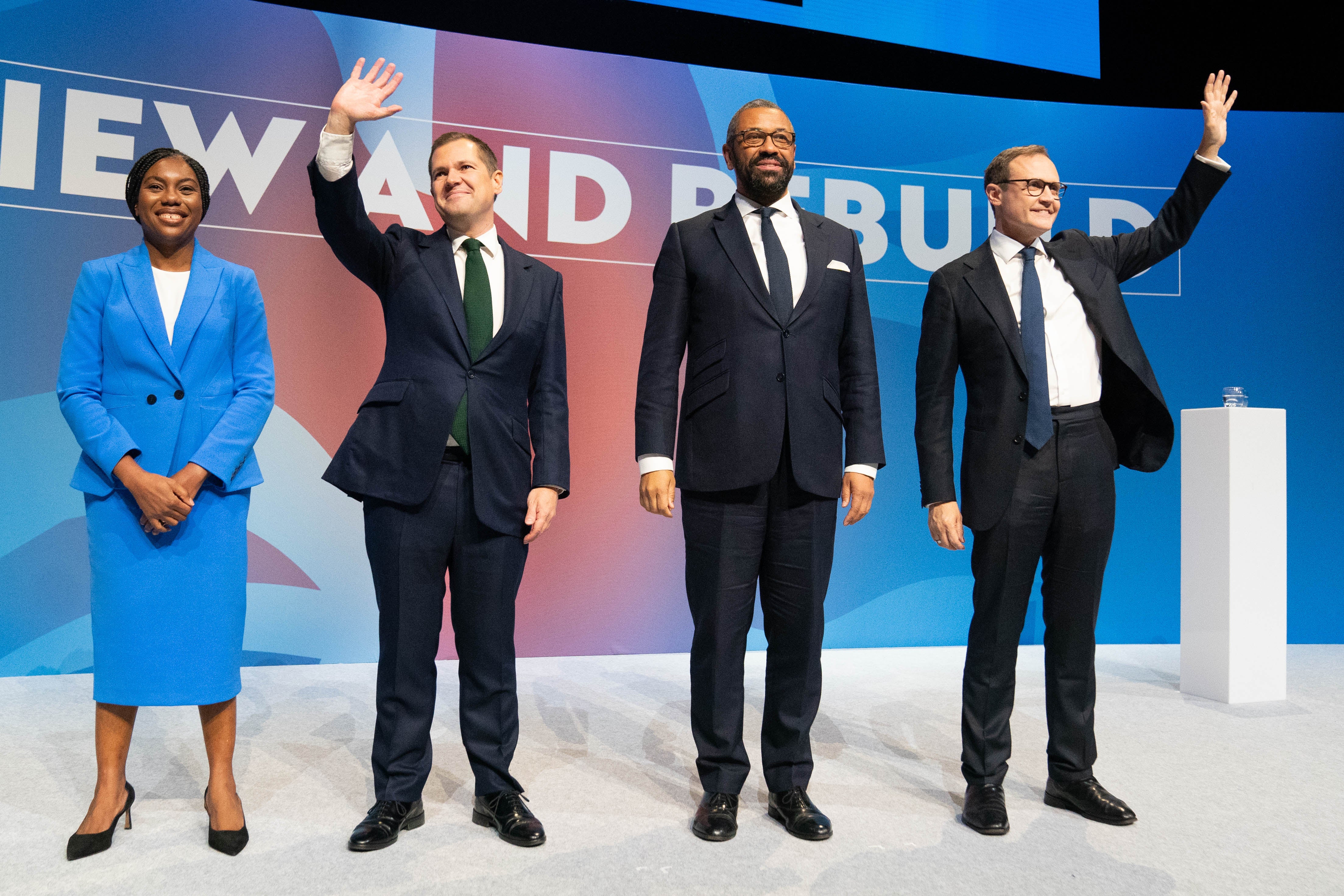 (left to right) Tory leadership candidates, Kemi Badenoch, Robert Jenrick , James Cleverly and Tom Tugendhat, stand together on stage