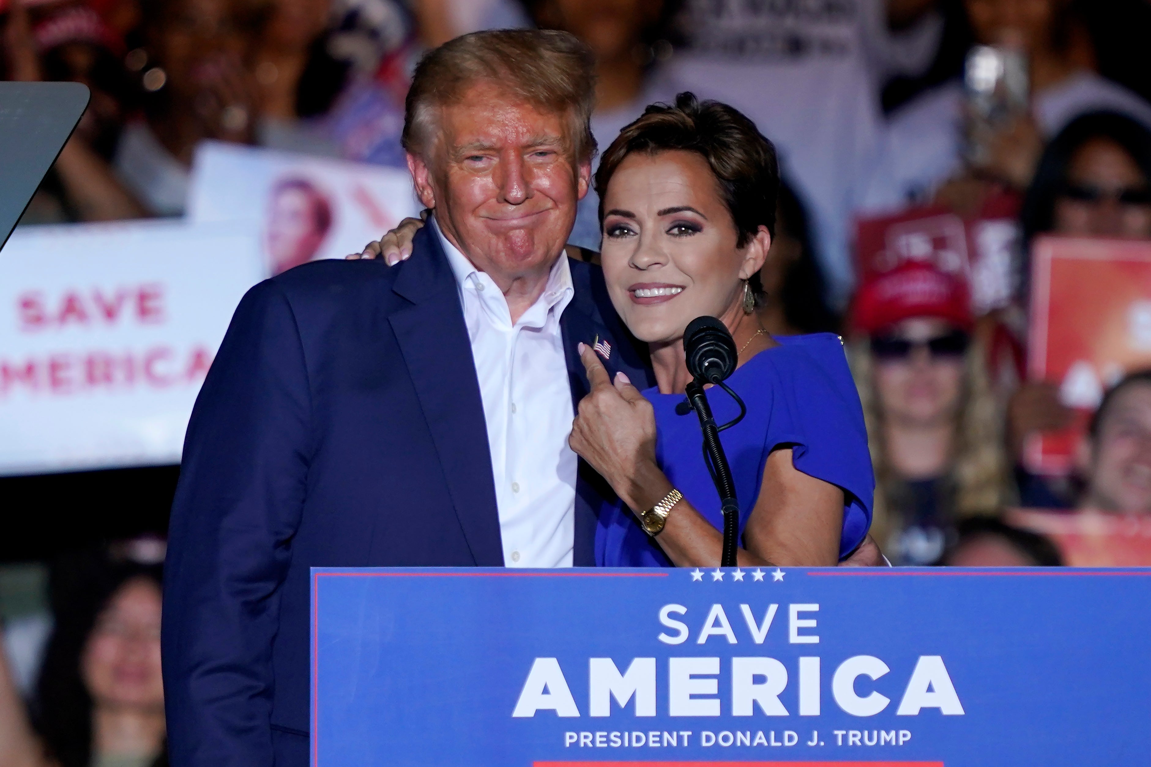 Arizona Republican candidate for Senate, Kari Lake, with Donald Trump at a rally in Mesa on October 9, 2022. She is among the MAGA-backed candidates trailing him in polls across the country.