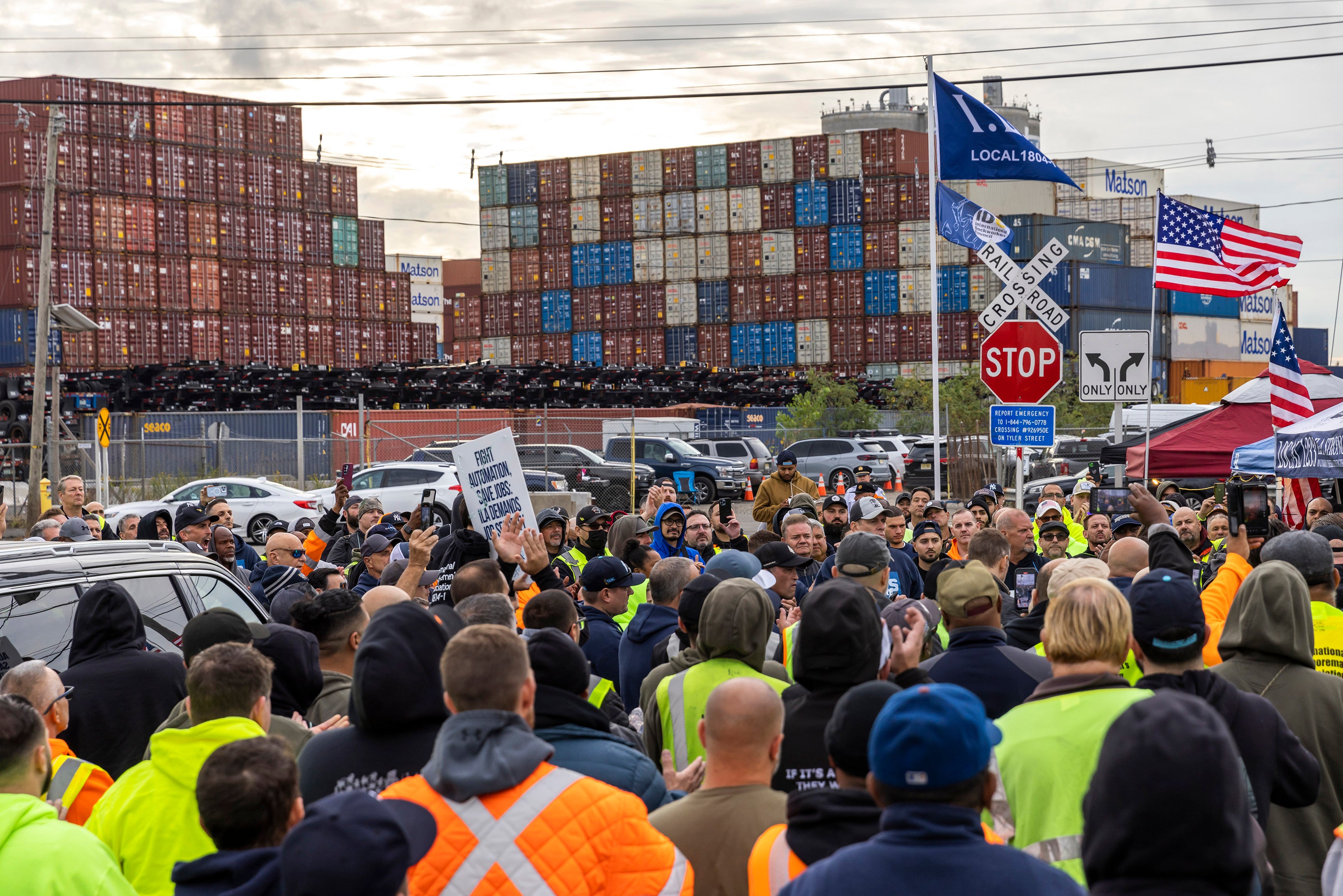 Workers participate in a dock strike at Port Newark in Bayonne, New Jersey, on Tuesday