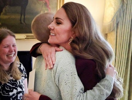 Princess Kate hugs a cancer-stricken teenager as she returns to work for the first time after undergoing chemotherapy