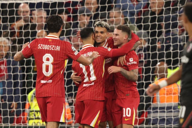 <p>Alexis Mac Allister, centre right, celebrates after scoring his Liverpool's opening goal</p>