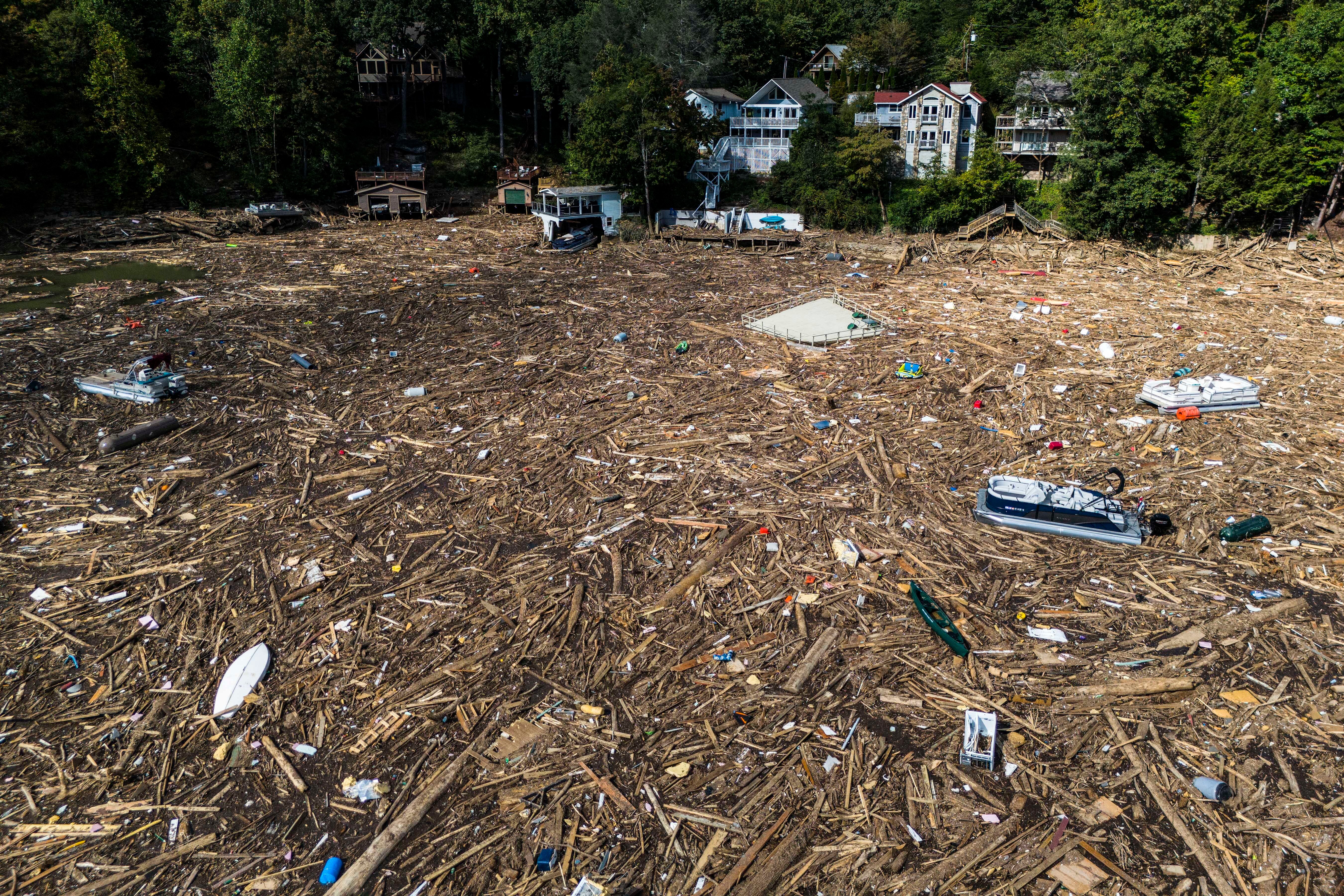 Debris is strewn on the lake in the aftermath of Hurricane Helene, Wednesday, Oct. 2, 2024, in Lake Lure, N.C.