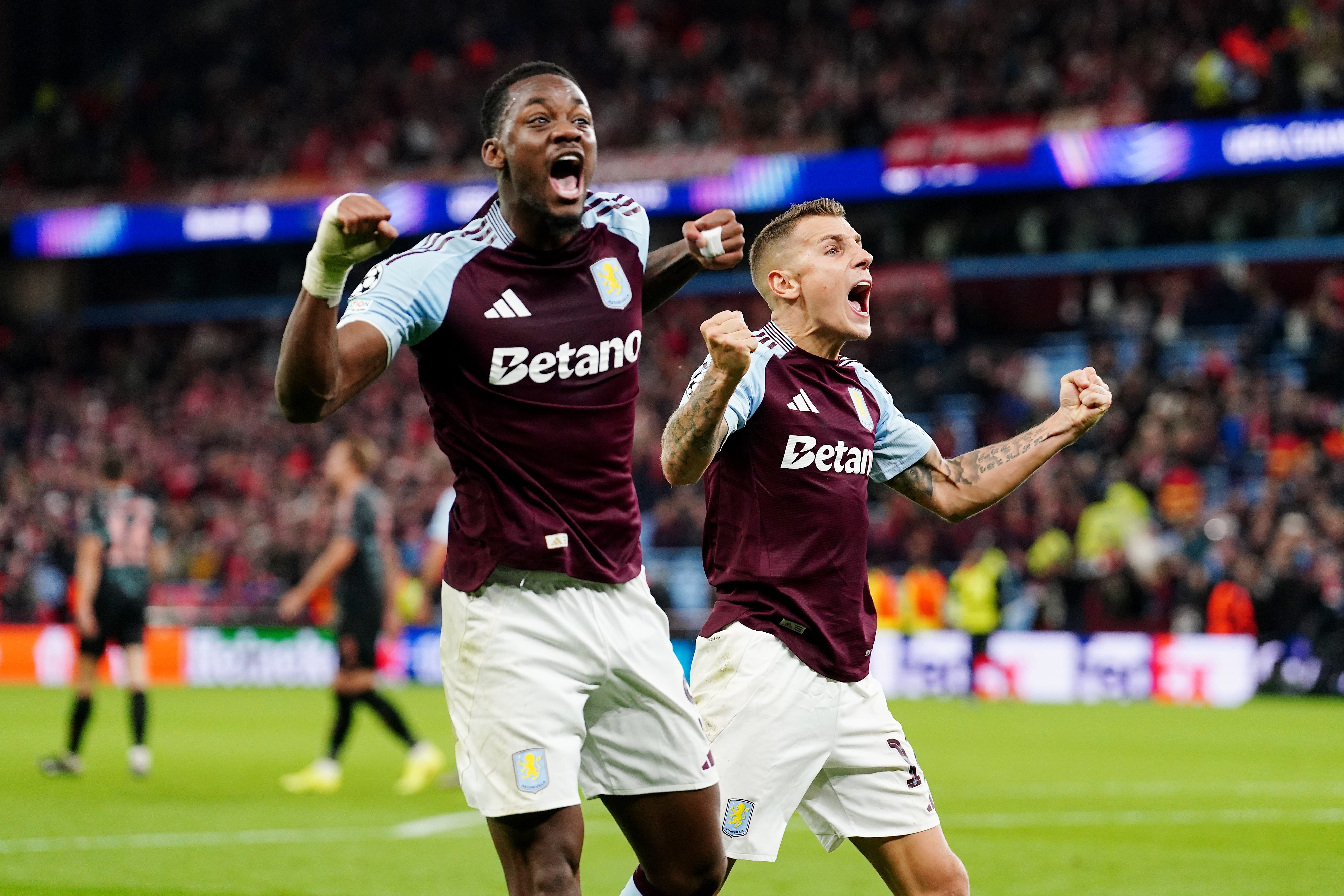 Jhon Duran, left, and Lucas Digne celebrate Aston Villa’s late winner over Bayern Munich