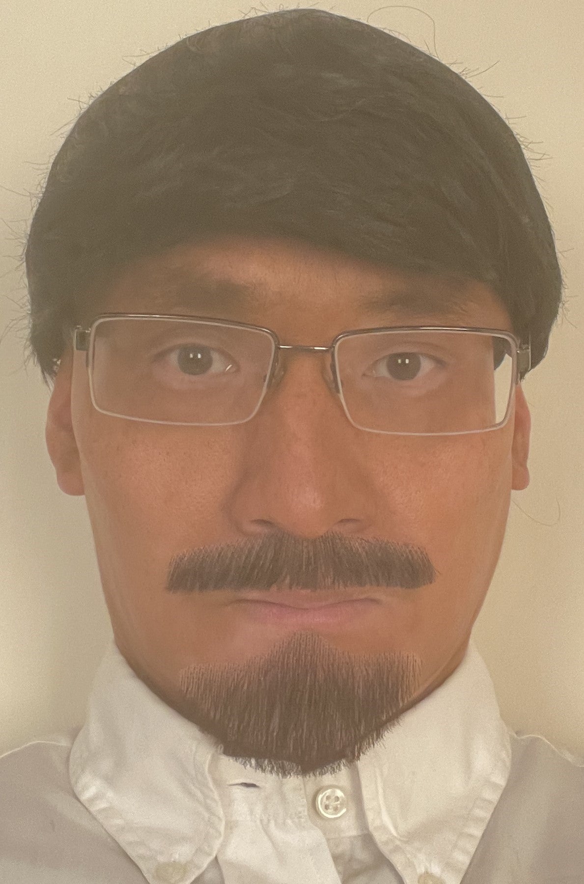 Undated handout photo issued by Northumbria Police of 53-year-old GP Thomas Kwan, wearing a disguise. The photo was found on his computer that he used to make a fake ID card