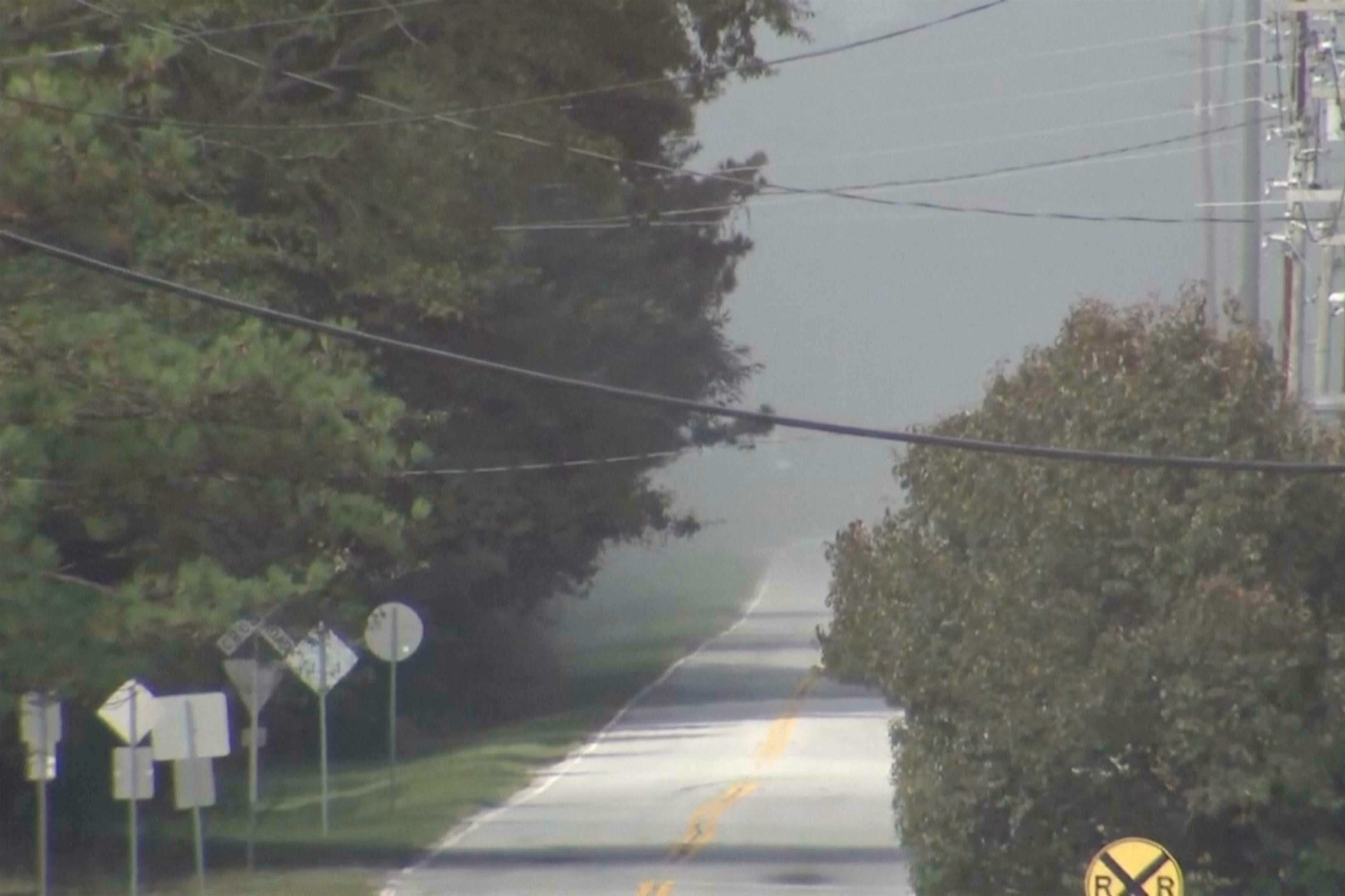 Smoke fills the air from a fire at the nearby BioLab plant on Sunday in Conyers, Georgia. The cause of the fire at the plant, which makes pool and spa treatment products, remains under investigation.