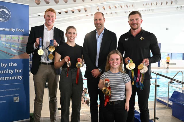 The Prince of Wales with Olympians and Paralympians Adam Peaty (right), Tom Dean (left), Maisie Summers-Newton (front right), and Louise Fiddes (second left) (Oli Scarff/PA)