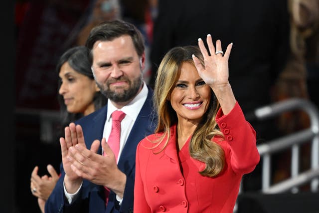 <p>Melania Trump waves next to JD Vance at the Republican National Convention. Melania came out in support of abortion rights in her forthcoming memoir, sparking anger from anti-abortion advocates</p>