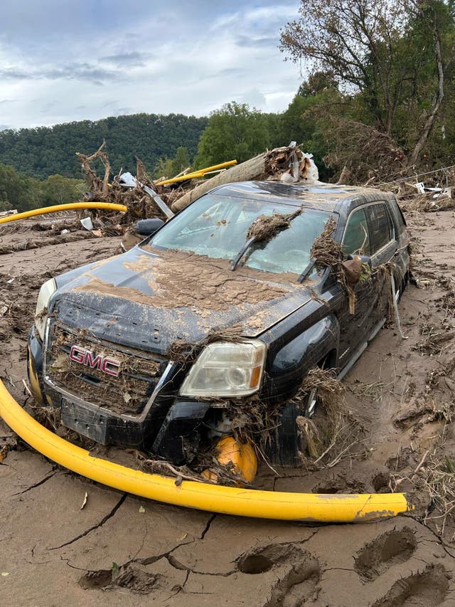 <p>Robert Jarvis’s GMC truck is stuck in the mud after Hurricane Helene brought widespread flooding to northeastern Tennessee last Friday. </p>