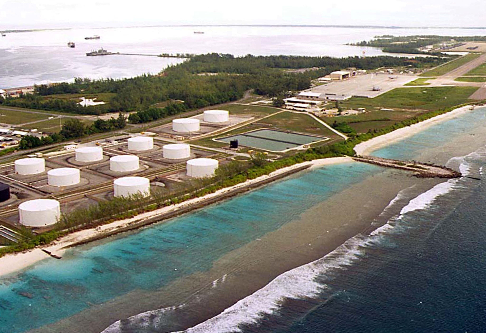 Fuel tanks sit at the edge of a miltary airstrip on Diego Garcia, the largest island in the Chagos archipelago and site of a major US military base in the middle of the Indian Ocean leased from Britain in 1966