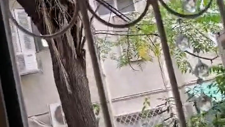 <p>British man takes shelter as air-raid sirens sound near Tel Aviv in Israel.</p>