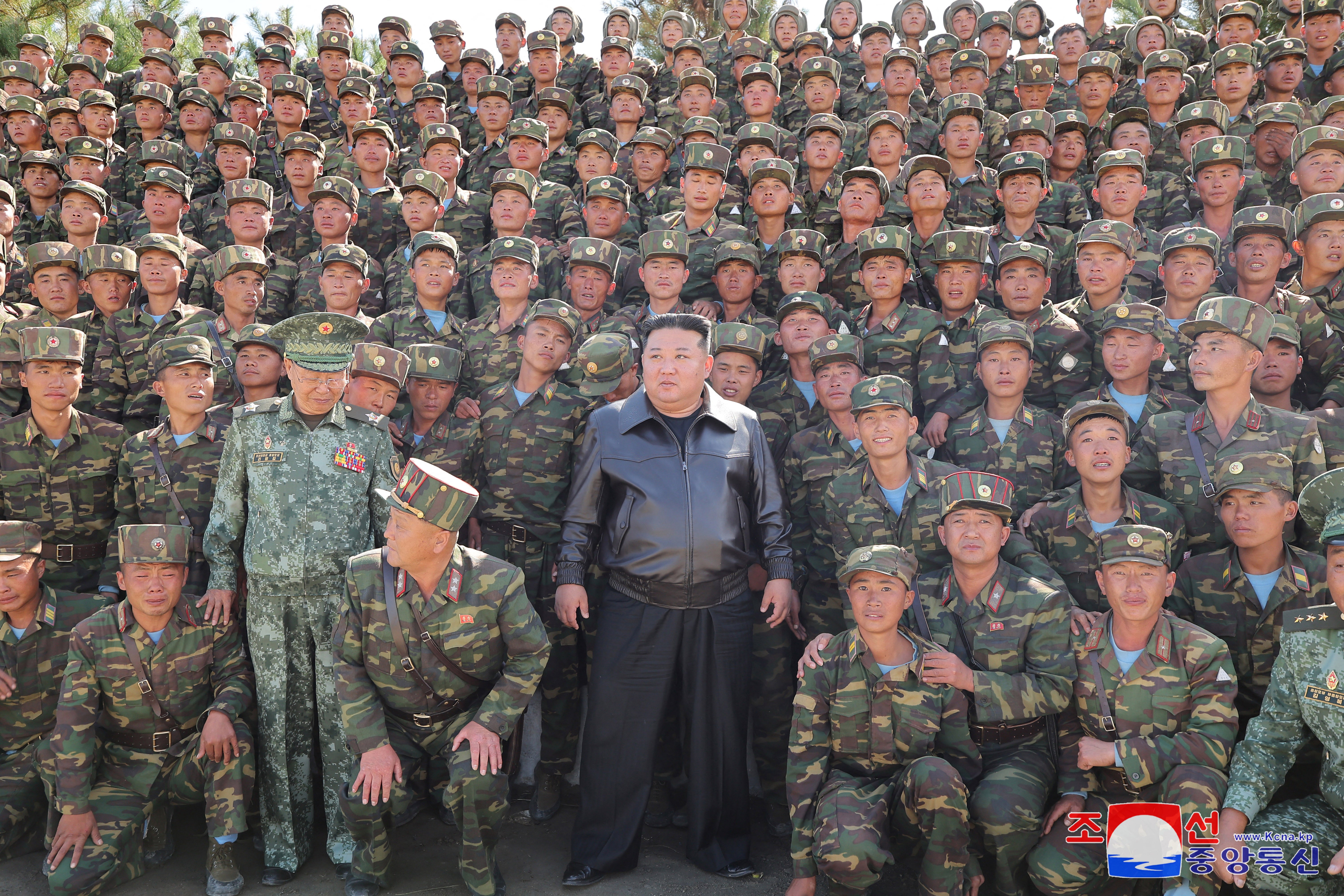 This picture taken on 2 October 2024 and released from North Korea's official Korean Central News Agency (KCNA) via KNS on 4 October 2024 shows North Korea's leader Kim Jong-un (C) posing with troops during an inspection at a training base of the Korean People's Army's special operations forces in the western region, at an undisclosed location in North Korea