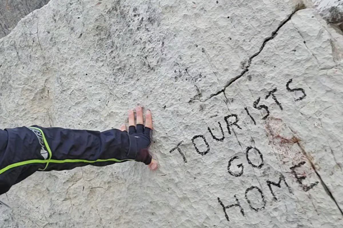 Anger in Italy as famous prehistoric rock defaced with anti-tourism slogan