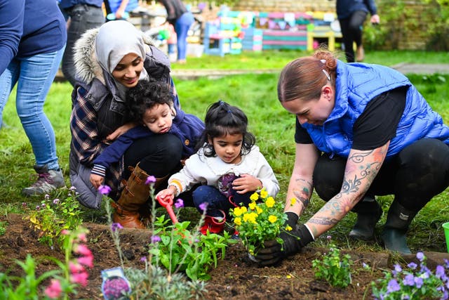 Lottery winner Katherine White helps spruce up a garden for toddlers at Sacrewell Farm in Peterborough. (National Lottery/ PA)