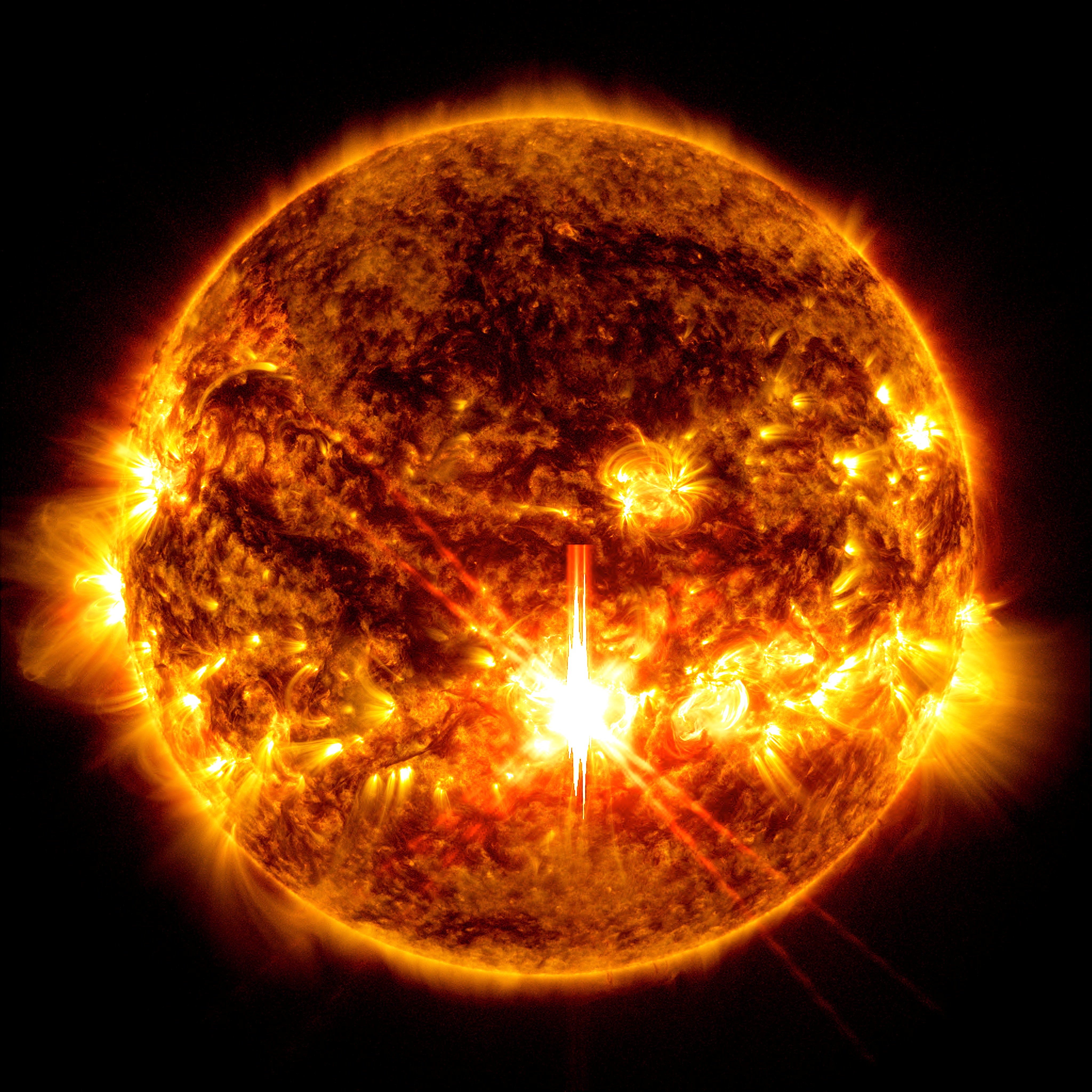 The X9.0 solar flare – seen as a bright flash in the centre of the sun (Nasa/SDO)