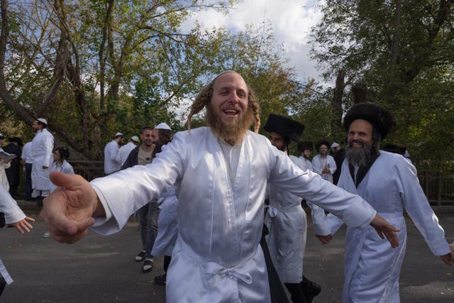 <p>Orthodox Jews dance at the tomb of Rabbi Nachman, the great grandson of the founder of Hasidic movemen</p>