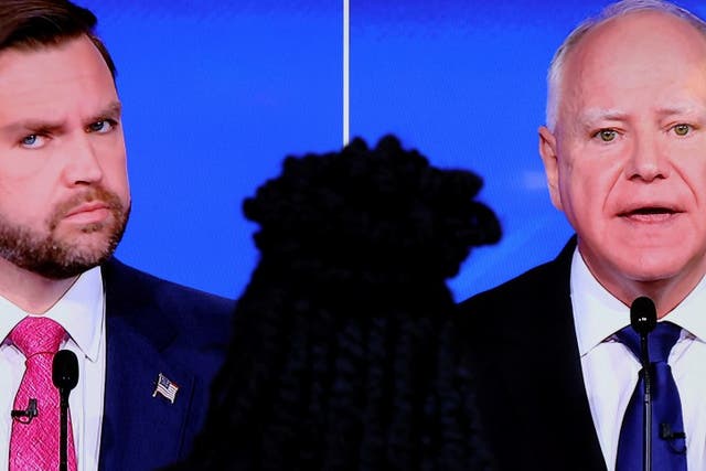 <p>A screen shows Republican vice presidential nominee US Senator JD Vance of Ohio and Democratic vice presidential nominee Minnesota Governor Tim Walz attending a debate hosted by CBS in New York City on 1 October 2024</p>