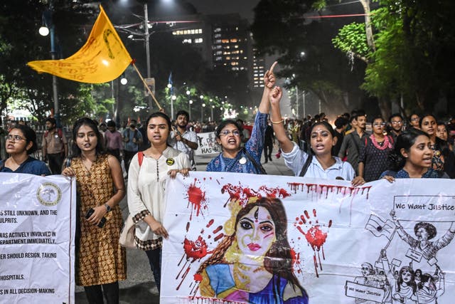 <p>Activists and medical professionals shout slogans during a protest march to condemn the rape and murder of a doctor, in Kolkata on 4 October</p>