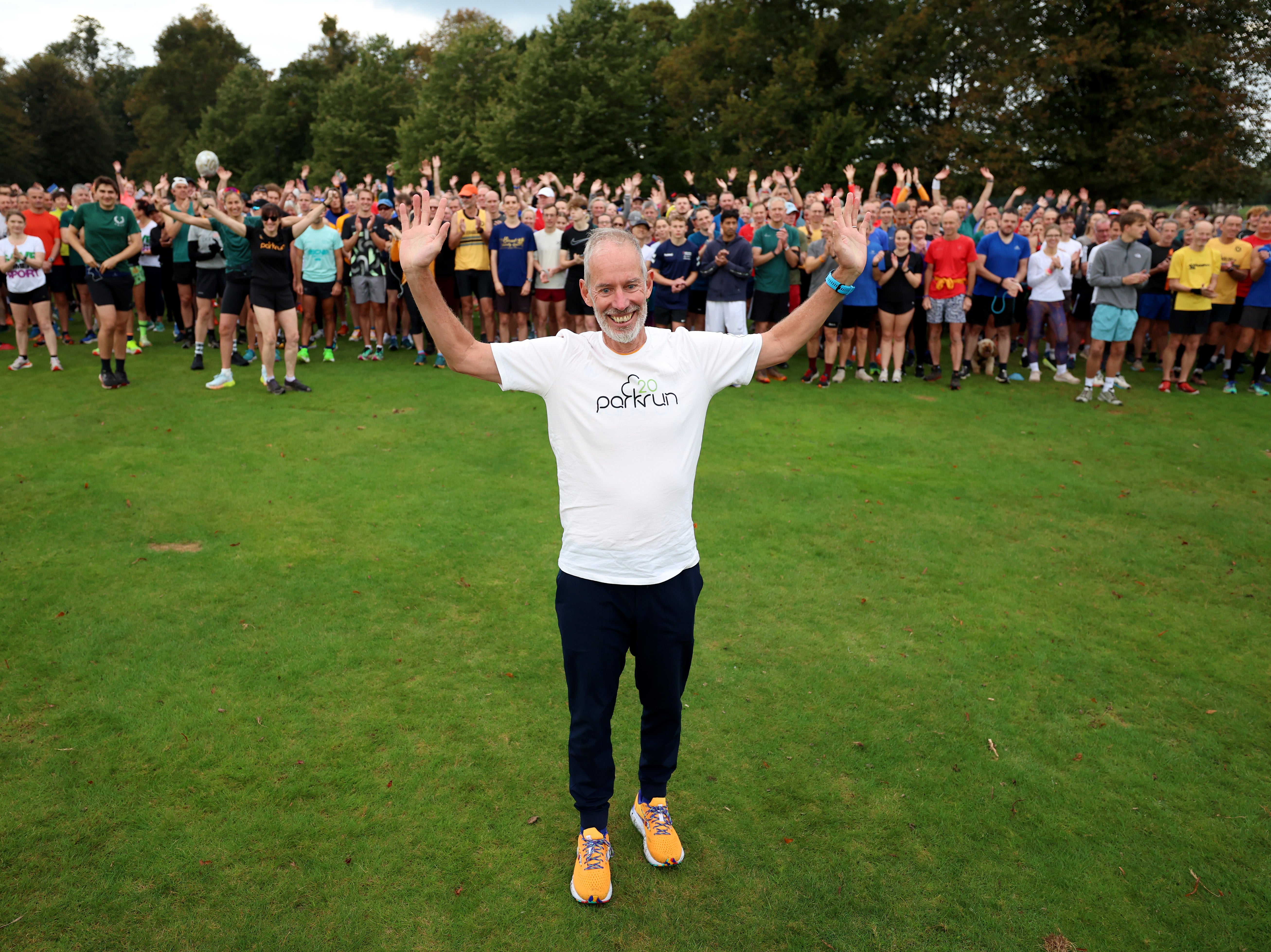 Parkrun founder Paul Sinton-Hewitt celebrates the charity's 20th birthday at Bushy Park, where the first ever event took place