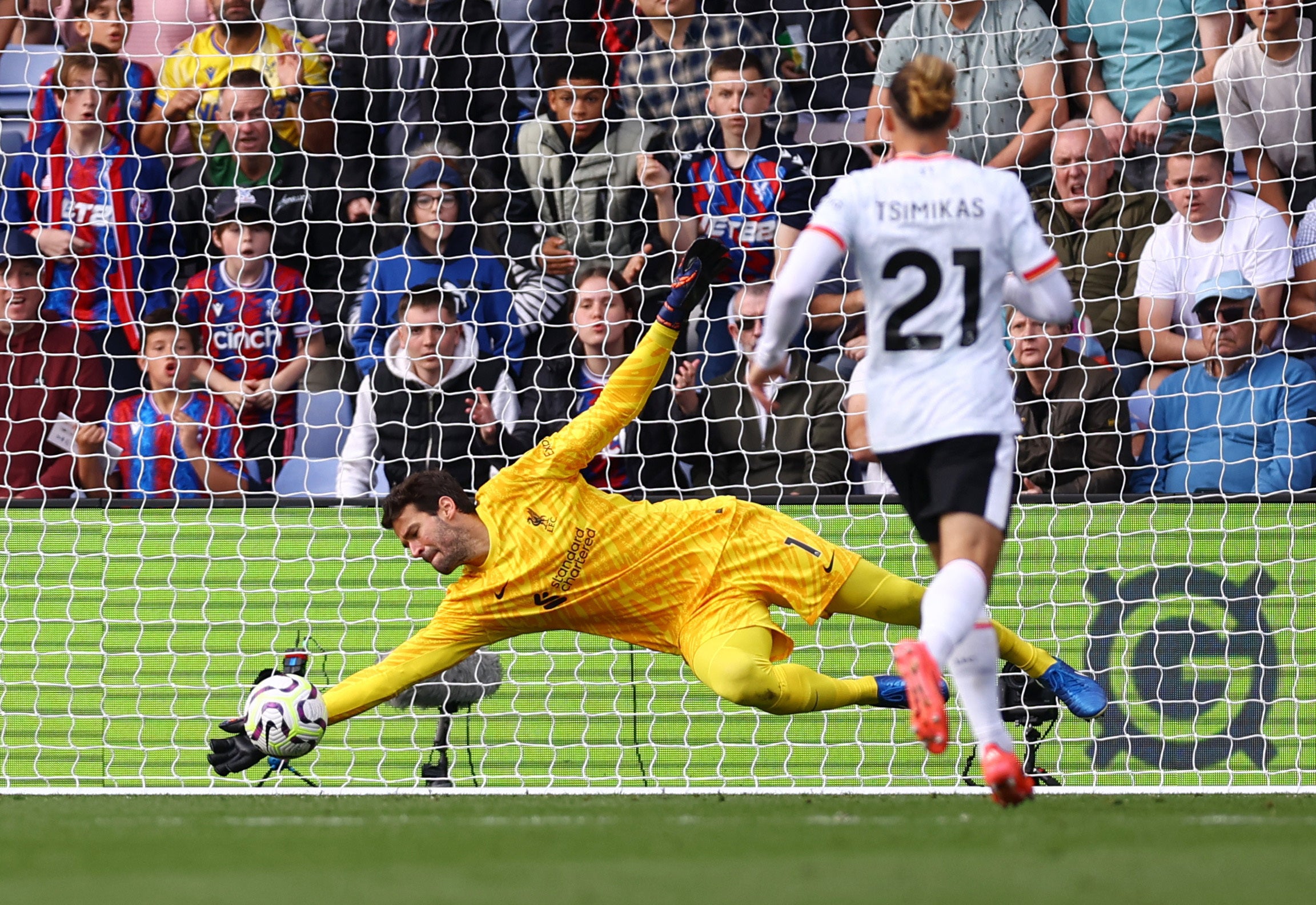 Alisson saved from Sarr before half-time