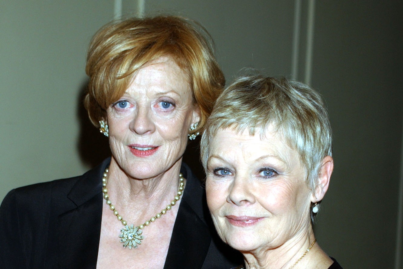 Close friends Dame Maggie Smith and Dame Judi Dench arriving at the Theatre Royal in 2001 – the pair were close friends after meeting in the 1950s