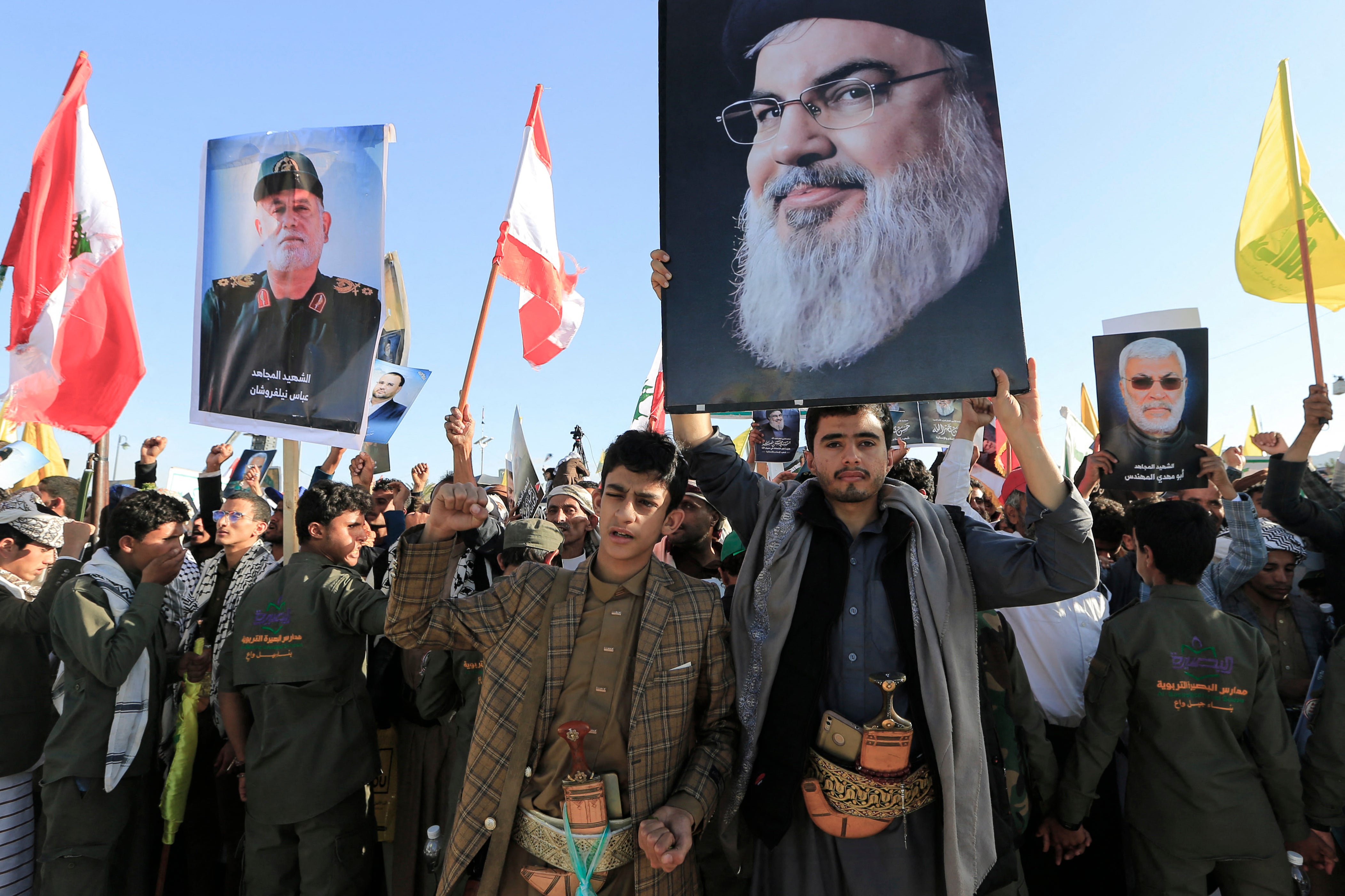 A Yemeni man lifts a picture of slain Lebanese Hezbollah leader Hassan Nasrallah, during a rally held in the Huthi-controlled capital Sanaa on October 4, 2024, in protest against Israel's attacks on Lebanon and the ongoing war between Israel and Hamas militants in the Gaza Strip