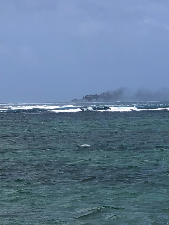 <p>A New Zealand Navy vessel on fire, as seen from Tafitoala, Samoa, 6 October 2024</p>