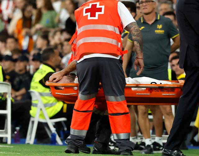 <p>Dani Carvajal is carried off the pitch on a stretcher</p>