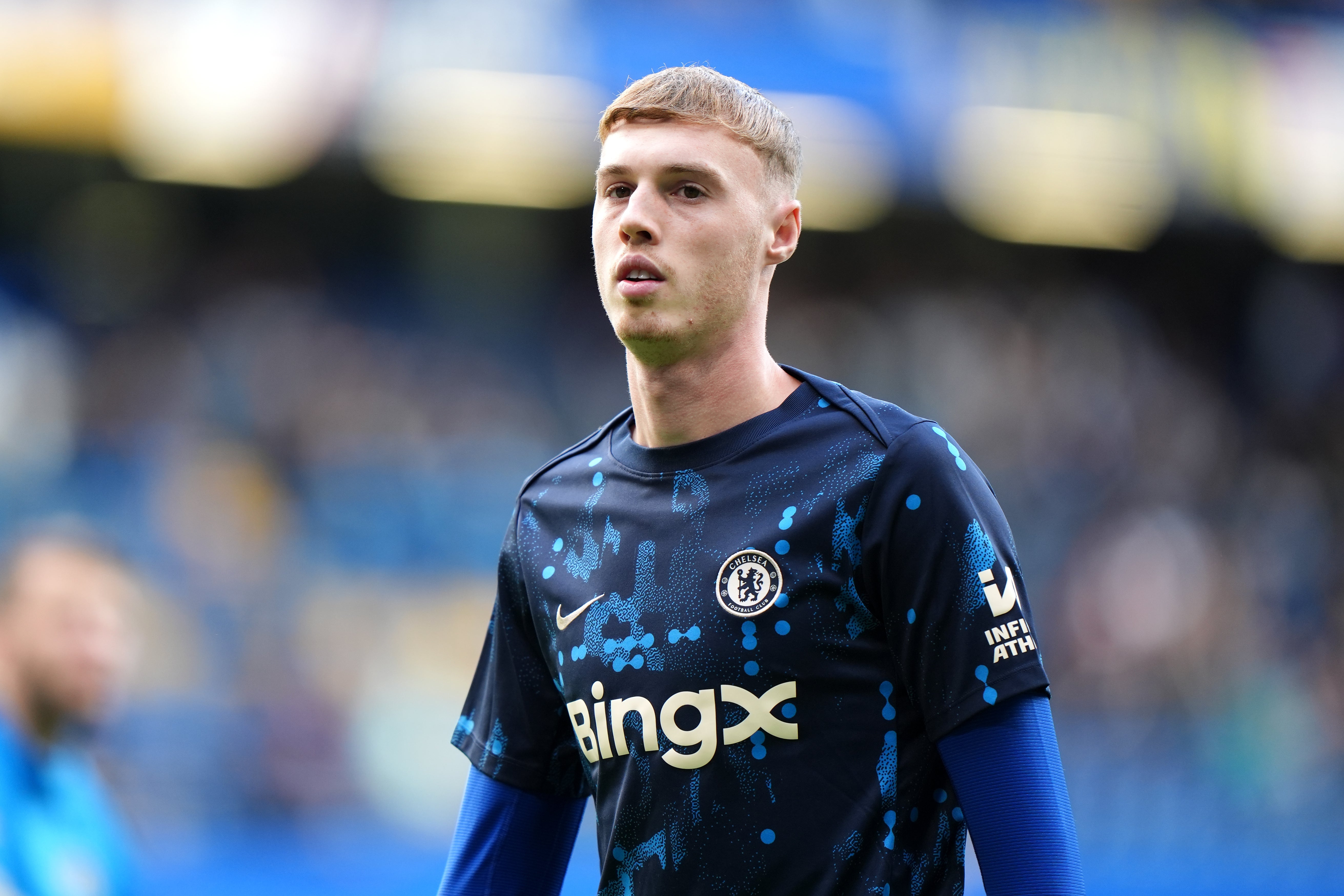 Cole Palmer warms up before kick-off at Stamford Bridge