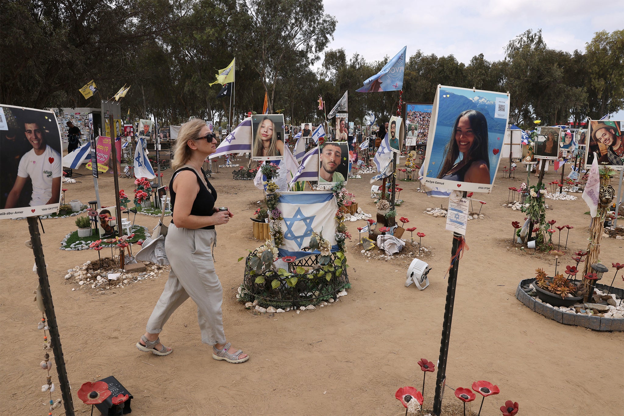 A woman visits an installation honouring those who were killed and kidnapped in the Supernova music festiva