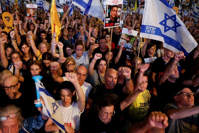 <p>People attend a protest calling for a hostage deal in Tel Aviv</p>