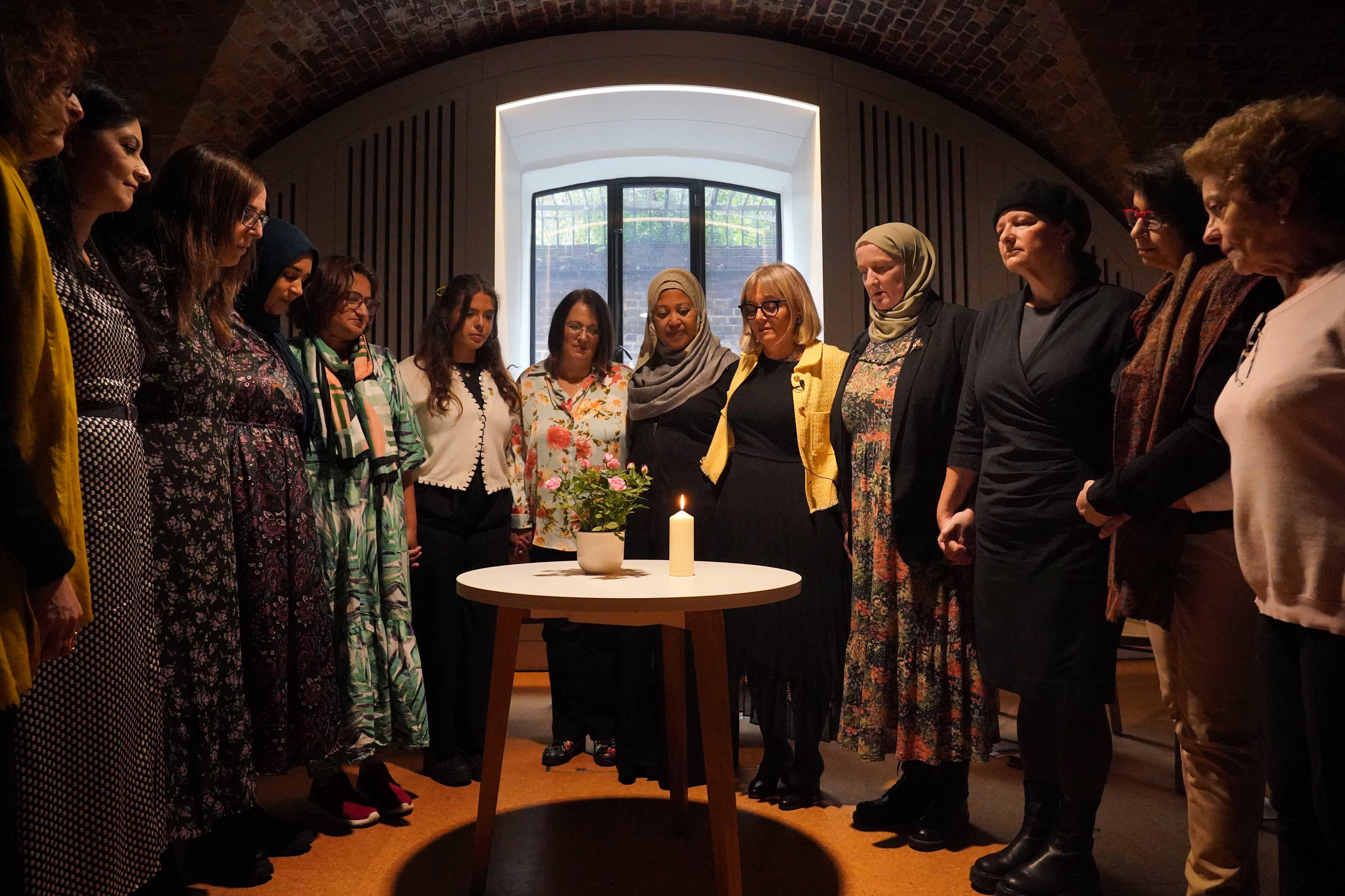 A group of Muslim and Jewish women during a minute silence after lighting a candle an event at St Johns Church, central London, to remember those who have died or are displaced and missing since the October 7 attack. Hamas undertook an unprecedented cross-border attack on Israel on October 7 2023, in which 1,200 people were killed and some 240 others were taken hostage. The year since has seen more than 41,000 Palestinians killed in the subsequent war in Gaza, during Israel’s military bombardment. Picture date: Sunday October 6, 2024.