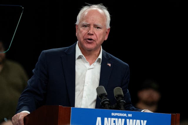 <p>Tim Walz delivers remarks at a campaign event in Wisconsin on September 14. </p>