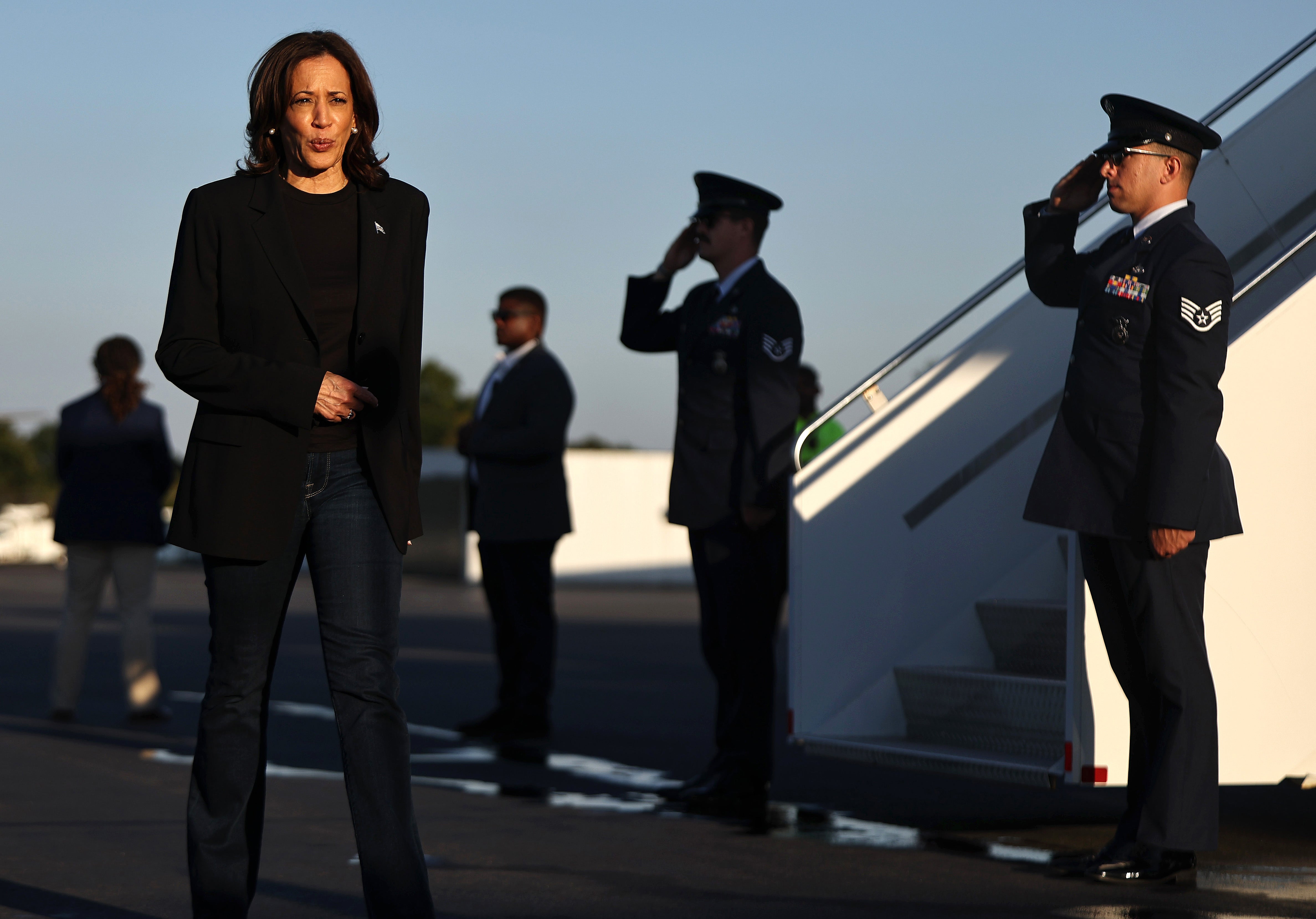 CHARLOTTE, NORTH CAROLINA - OCTOBER 05: Democratic presidential nominee, Vice President Kamala Harris walks to speak to the media before boarding Air Force Two after assessing the Hurricane Helene recovery response in North Carolina on October 5, 2024 in Charlotte, North Carolina. Harris was briefed on recovery operations at the Charlotte Air National Guard Base, visited a donation drop-off site for storm victims and met with impacted families. According to the Vice Presidentâs office, 74 percent of people who lost electricity during the storm now have power restored. (Photo by Mario Tama/Getty Images) ***BESTPIX***