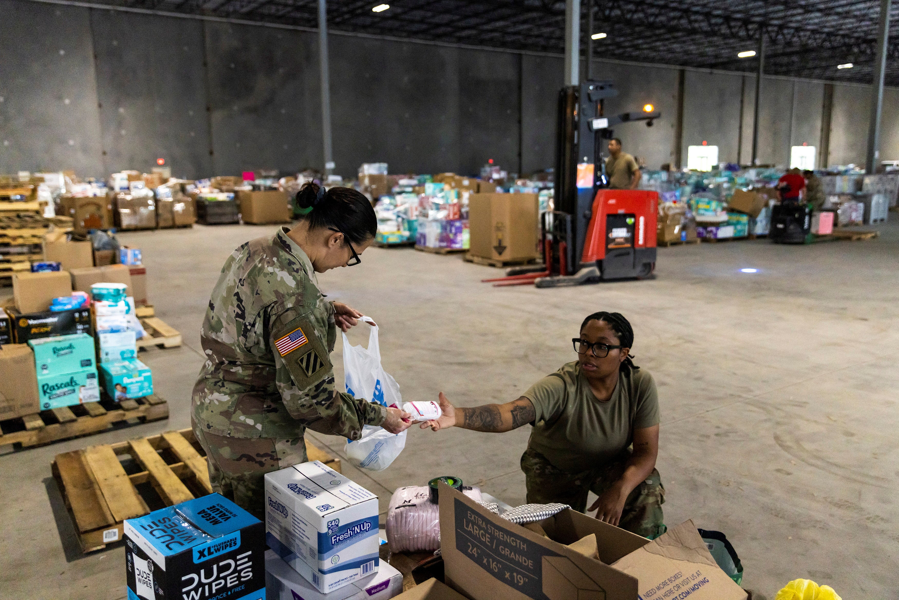 National Guard members organize donations to be distributed to survivors following the passing of Hurricane Helene in Hendersonville, North Carolina, on October 6.