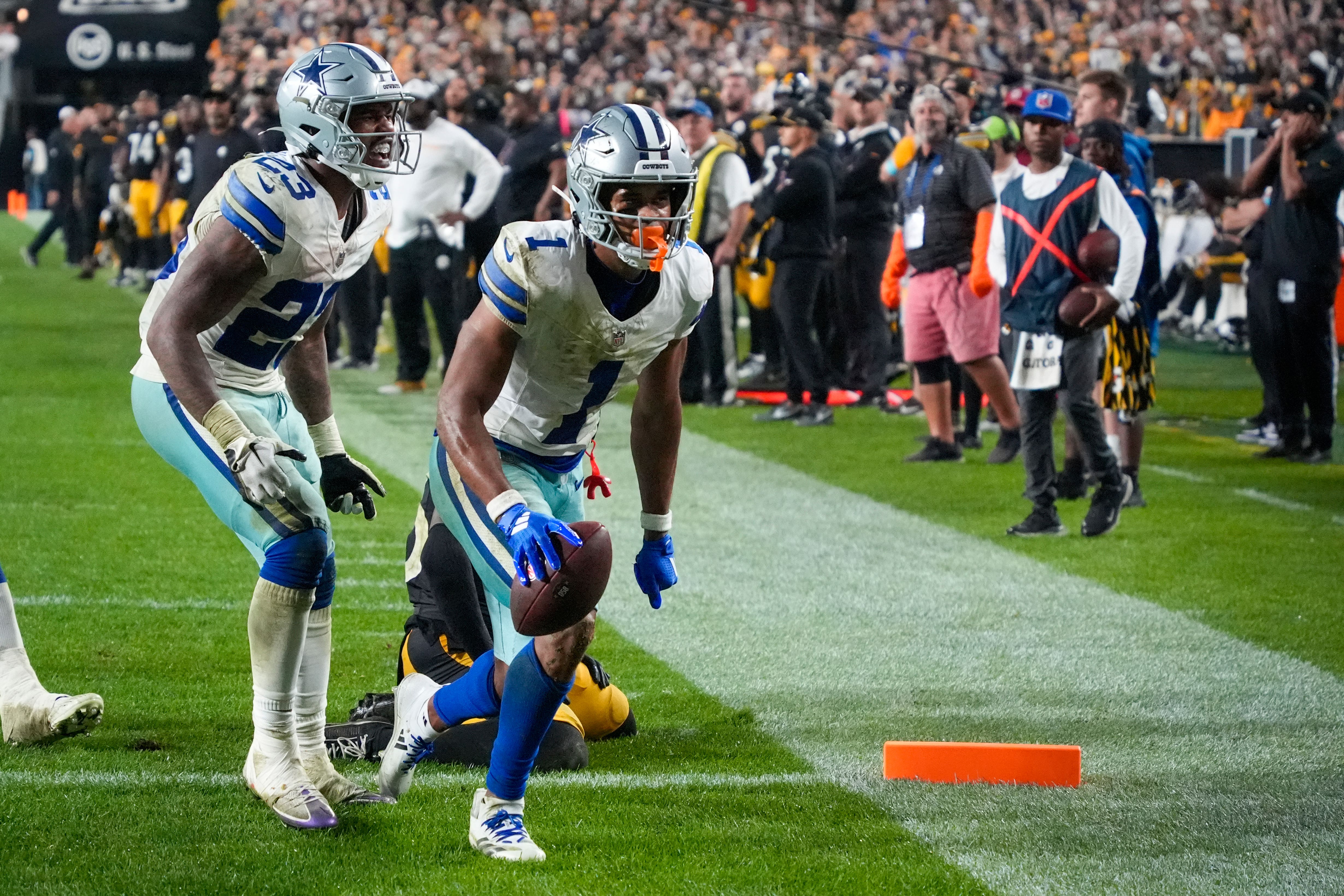 Dallas Cowboys wide receiver Jalen Tolbert celebrates his touchdown catch with running back Rico Dowdle (Gene J Puskar/AP)