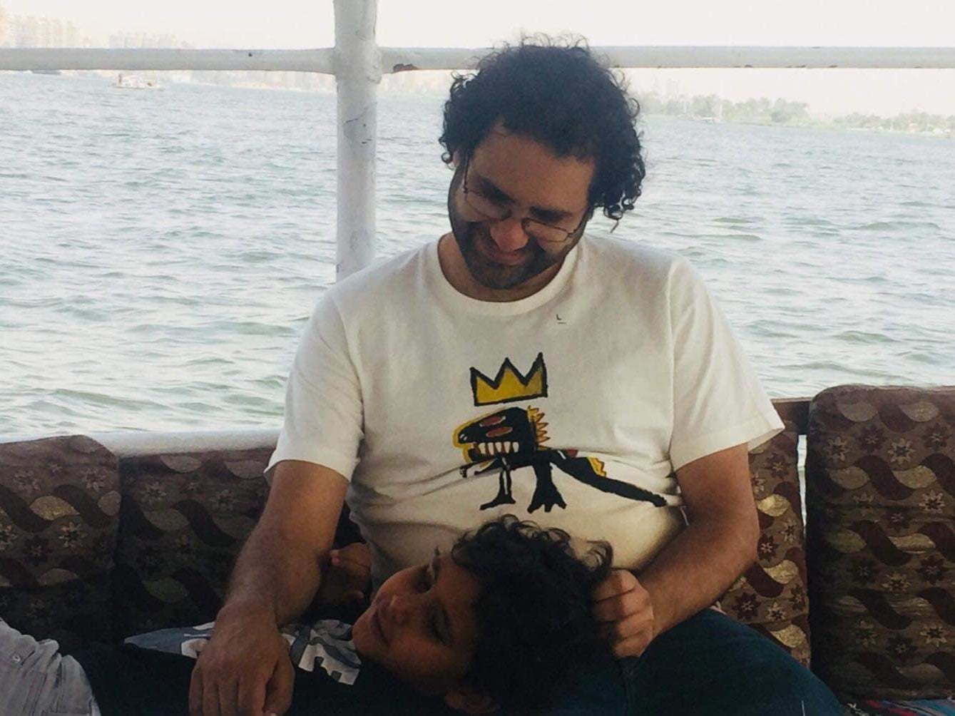 Alaa Abdel-Fattah, pictured with his son Khaled in 2019, was arrested in Egypt in September of that year after being accused of joining and funding a terrorist group