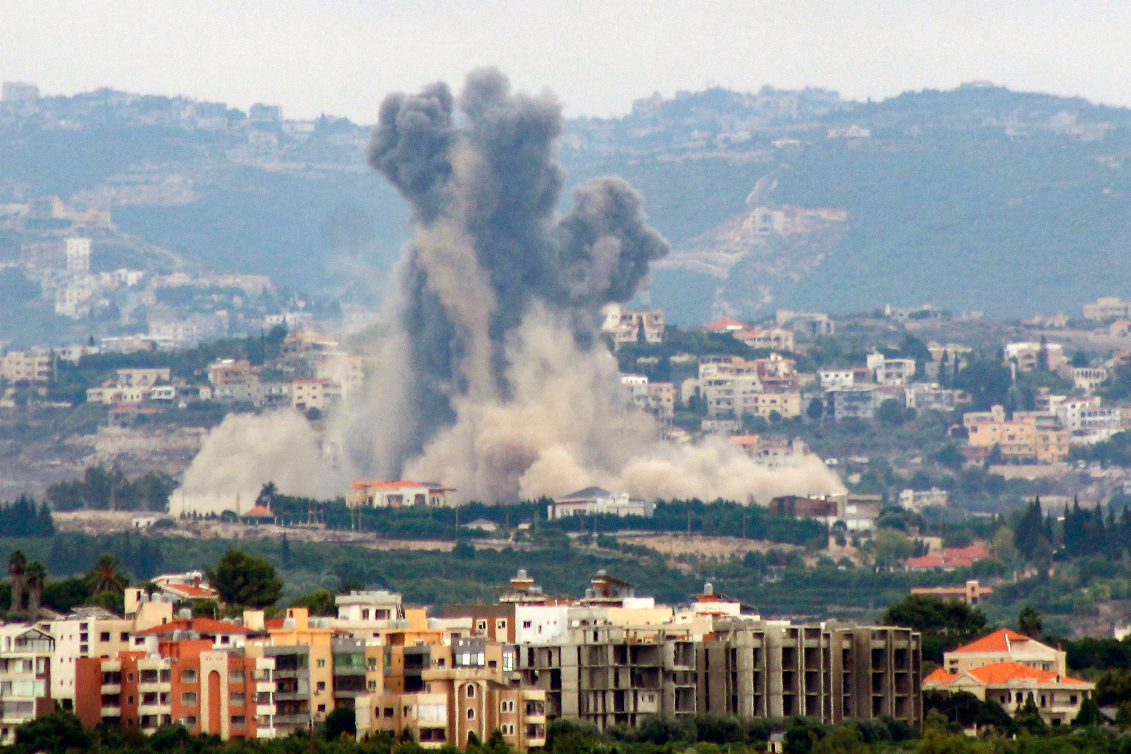 This picture taken from the southern city of Tyre shows smoke billowing from the site of an Israeli airstrike that targeted the southern Lebanese village of Rmadiyeh