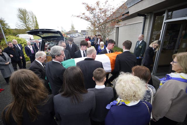 The coffin of former Fianna Fail minister Mary O’Rourke is carried into Our Lady Queen of Peace Church in Coosan (Niall Carson/PA)