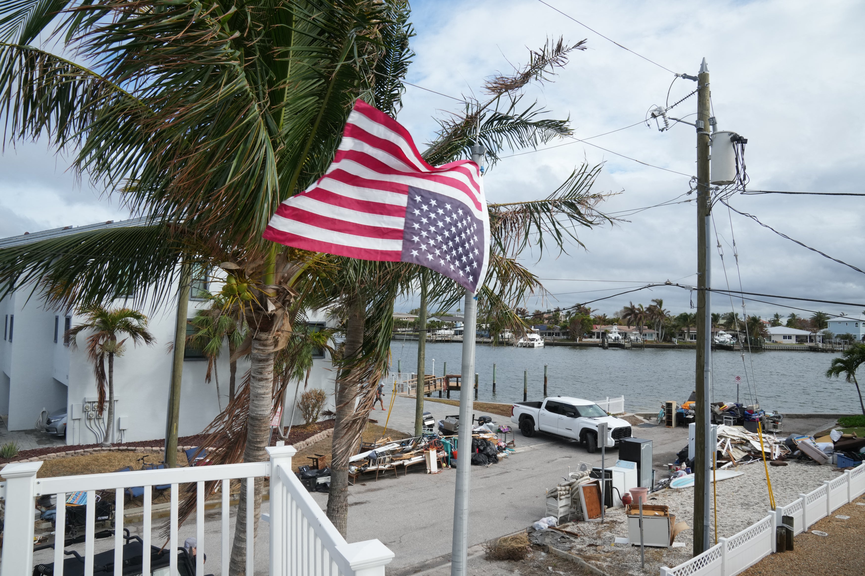 American flag flies upside down at a home ahead of Hurricane Milton's expected landfall in Treasure Island, Florida on October 7, 2024