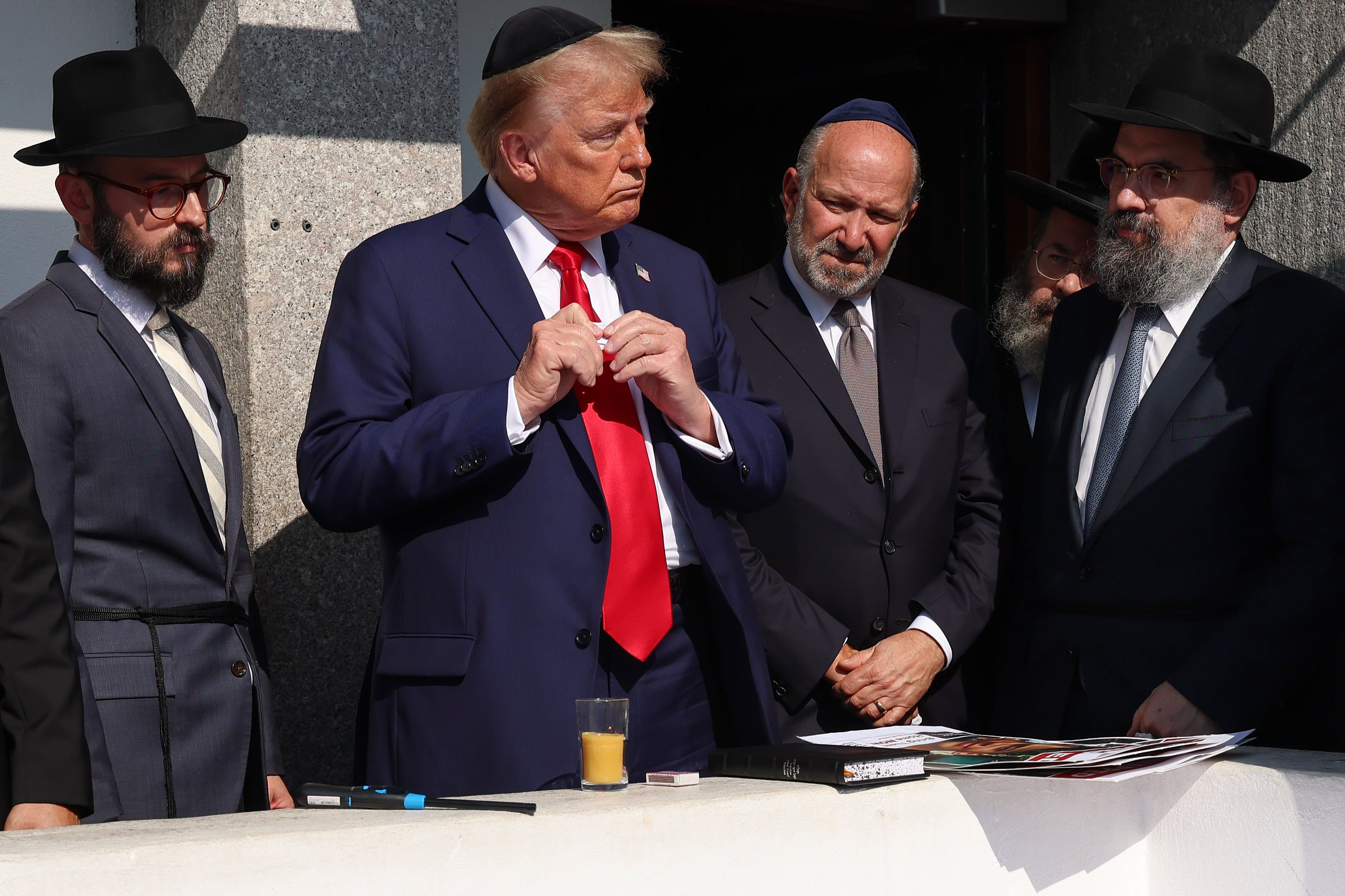 Trump at the gravesite of Rabbi Menachem Mendel Schneerson at Ohel Chabad-Lubavitch, in Queens, New York City, on Monday