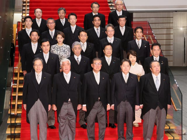 <p>This picture taken on 1 October 2024 shows Japan’s new prime minister Shigeru Ishiba (front C) posing during a photo session with the members of his cabinet at the prime minister’s official residence in Tokyo</p>