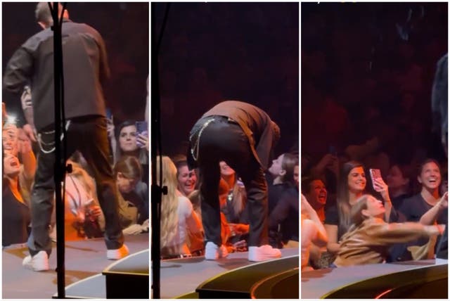 <p>Justin Timberlake approaches fans, spotting one who was too busy messaging on her phone to notice</p>
