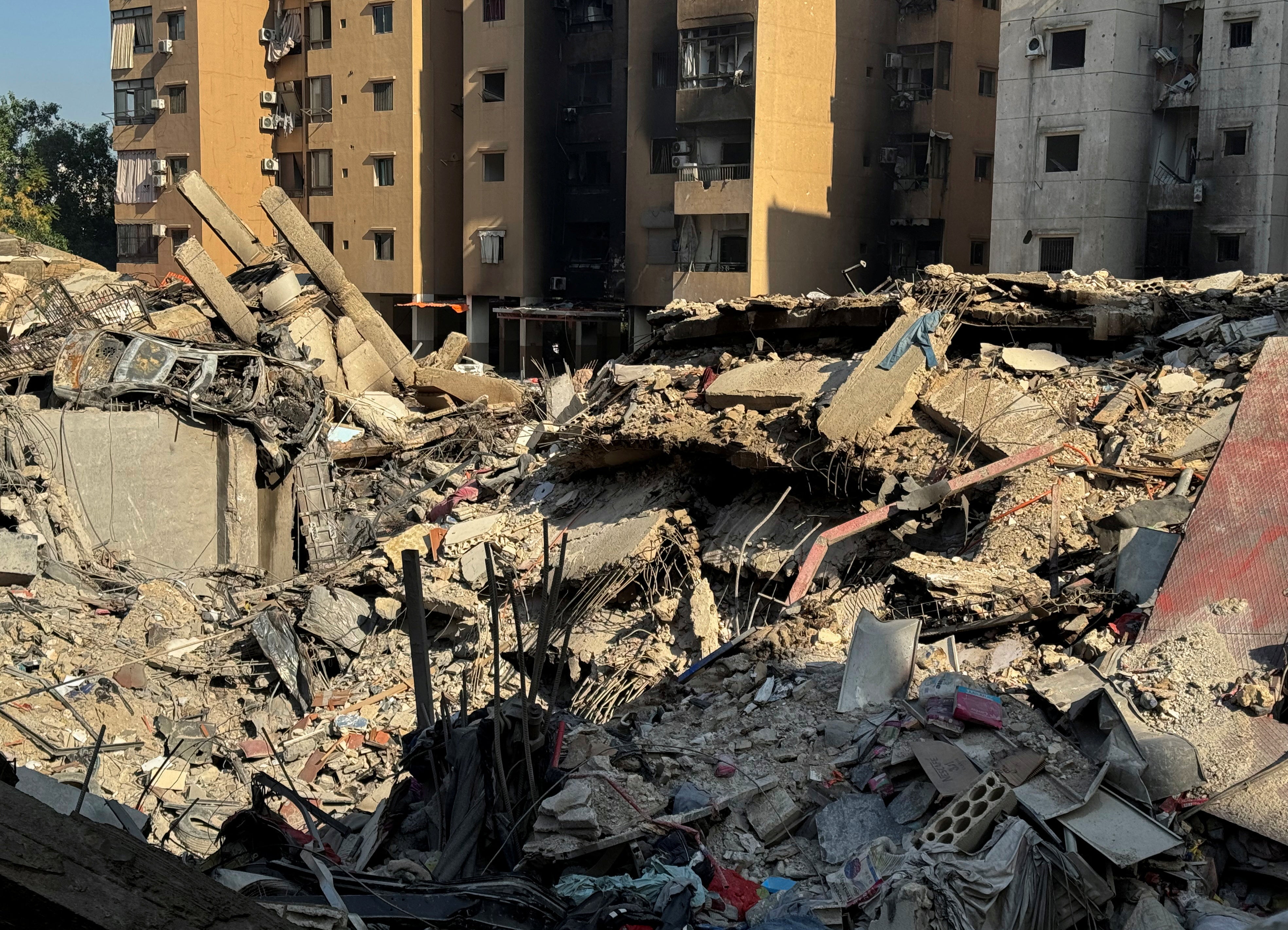 A car, iron and bricks lie in a twisted heap following Israeli airstrikes on Beirut overnight