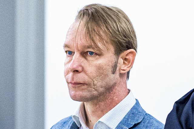 <p>Brueckner standing next to his lawyer Friedrich Fuelscher at his trial on unrelated sexual assault charges</p>