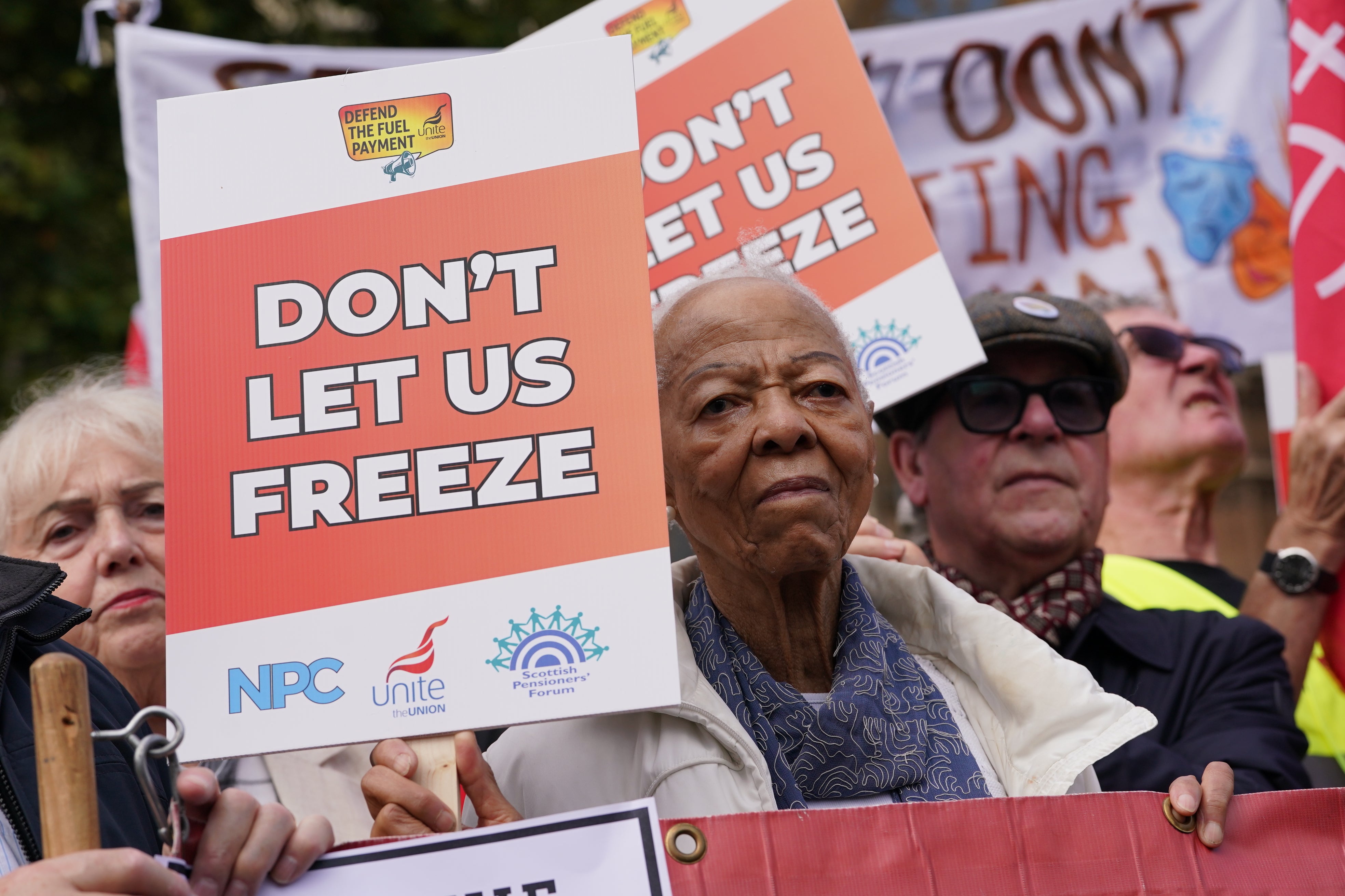 Campaigners take part in a protest against the government's decision to scrap the winter fuel allowance for pensioners, outside the Houses of Parliament in Westminster, central London.