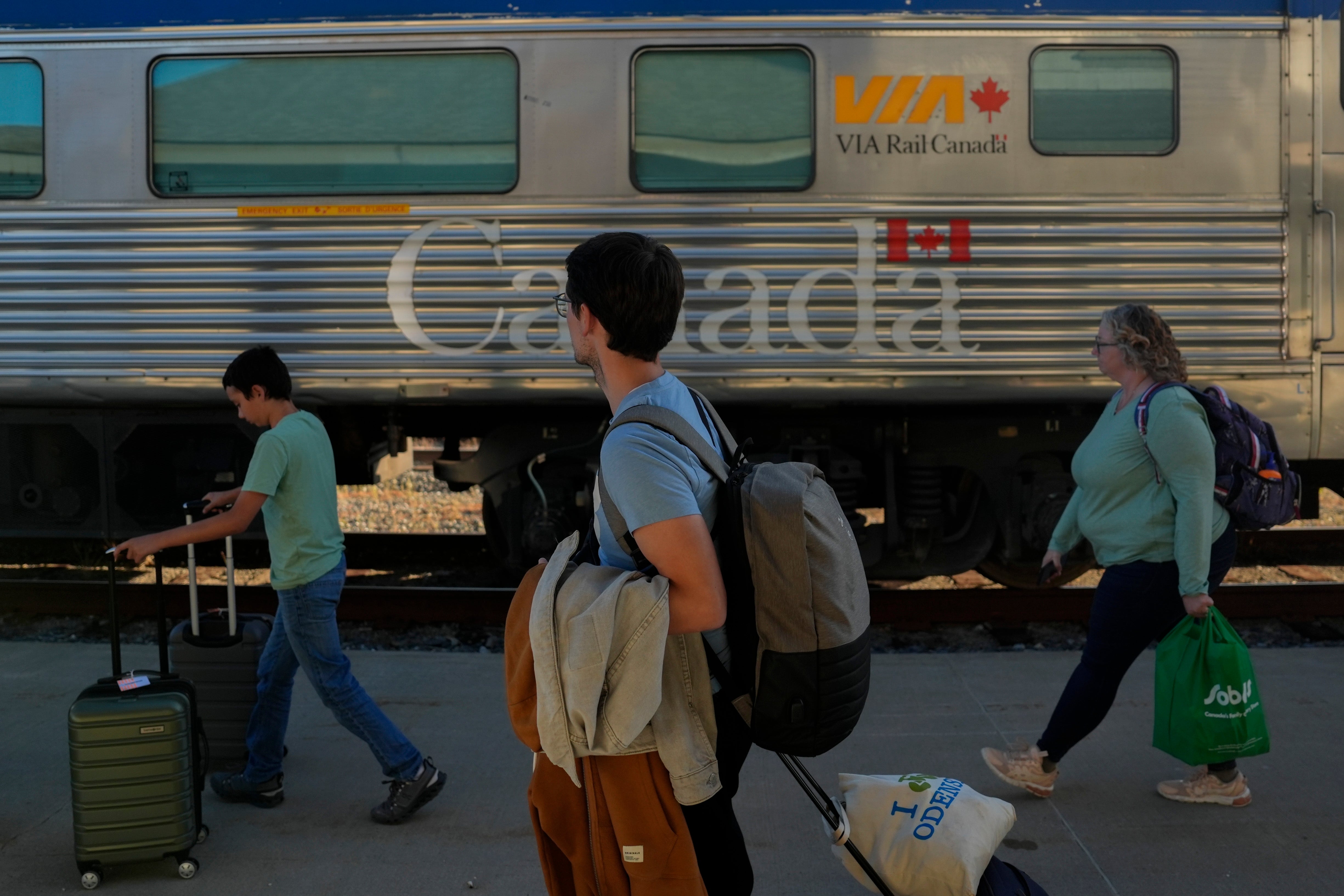 Passengers prepare to board a train Thursday, August 8, 2024, in Churchill, Manitoba