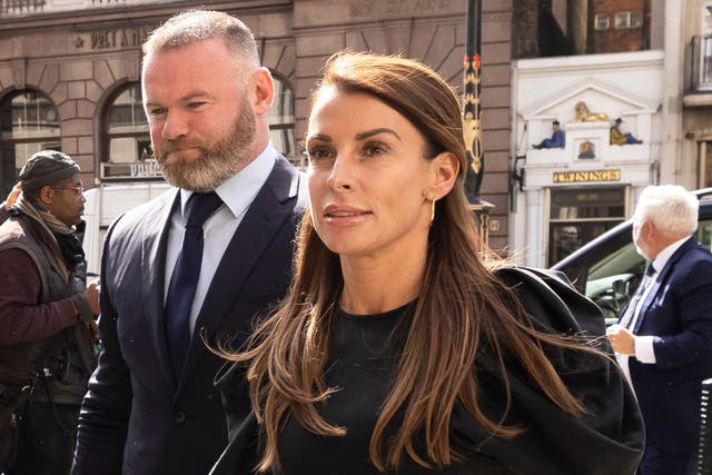 <p>Coleen Rooney arrives with husband Wayne Rooney at Royal Courts of Justice, Strand on May 12, 2022 in London</p>