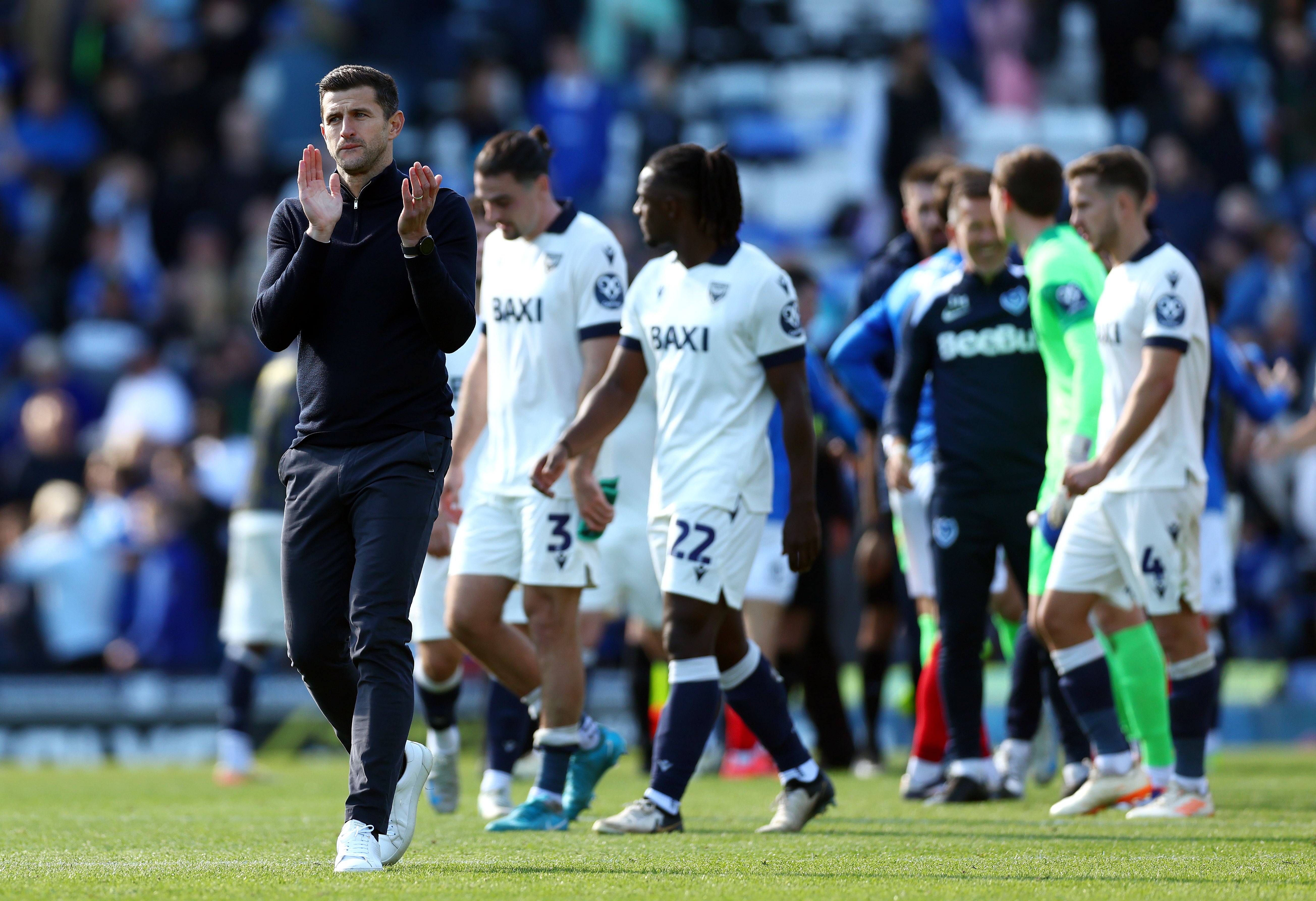 Portsmouth head coach John Mousinho (left) apologised to the linesman after the game over the alleged abuse from the stand at Fratton Park