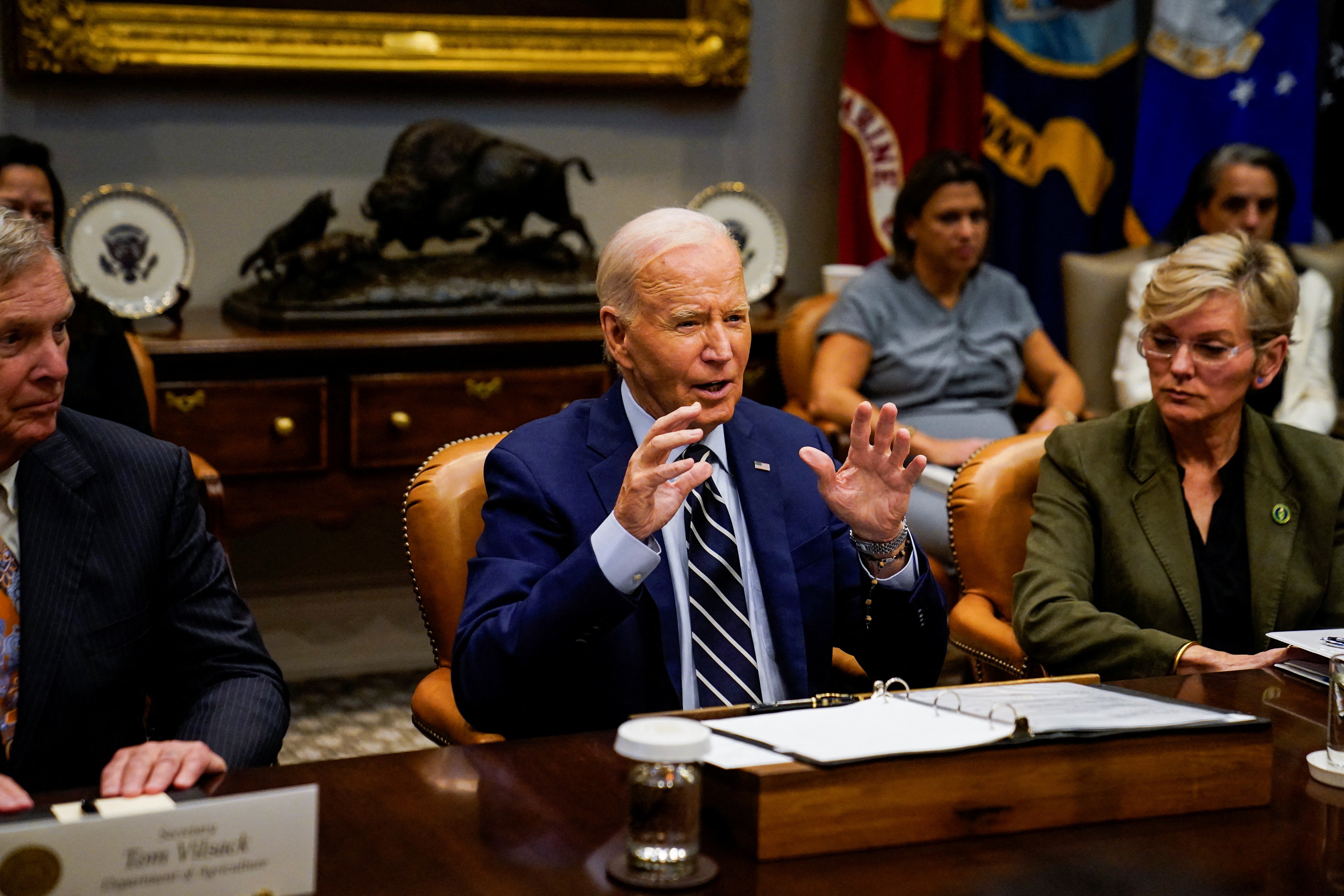 President Joe Biden speaks about the federal government response to Hurricane Helene and preparations for Hurricane Milton, as he sits between U.S. Secretary of Agriculture Tom Vilsack and U.S. Secretary of Energy Jennifer Granholm, from the Roosevelt Room of the White House